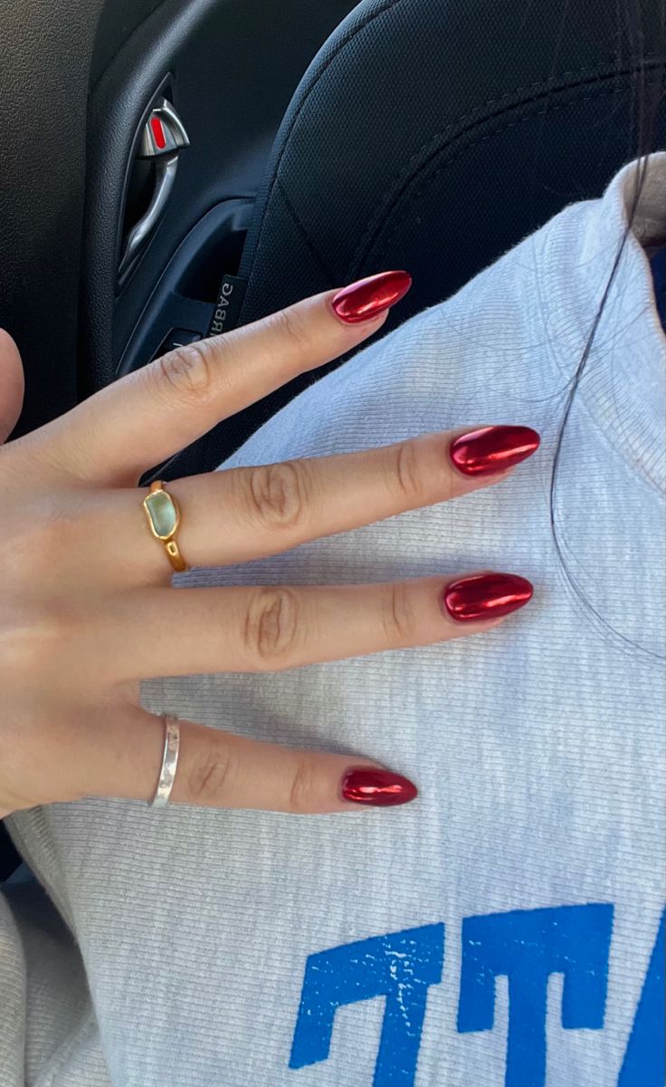 Elegant Statement: Glossy Red Almond-Shaped Nails with Minimalist Rings