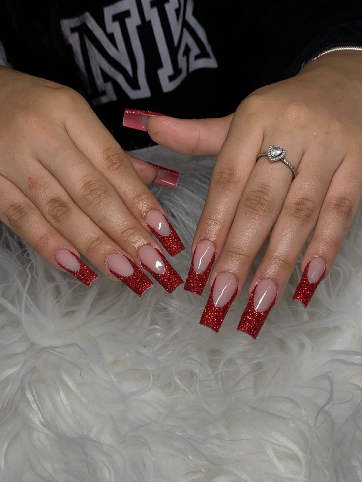 Elegant Ombre Red Glitter Nail Design: A Glamorous Statement for Special Occasions.