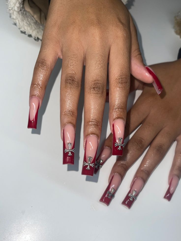 Sophisticated Long Square Nail Design in Striking Red and Nude with Intricate Metallic Accents.