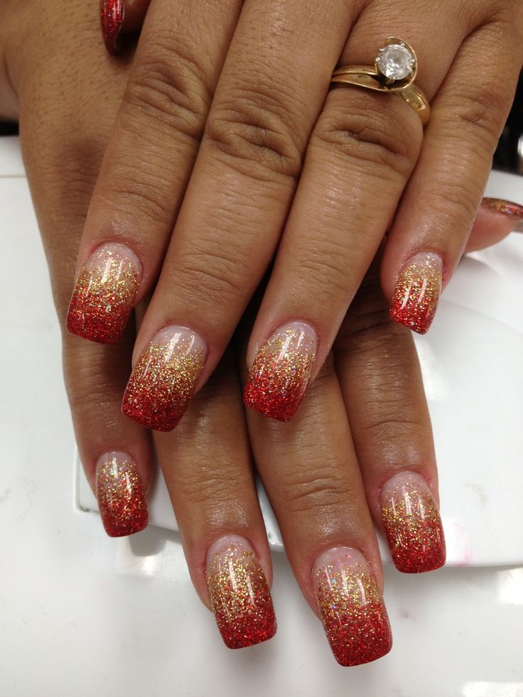 Stunning Glittery Ombre Nails: Bold Red to Gold Gradient with Glamorous Sparkling Tips