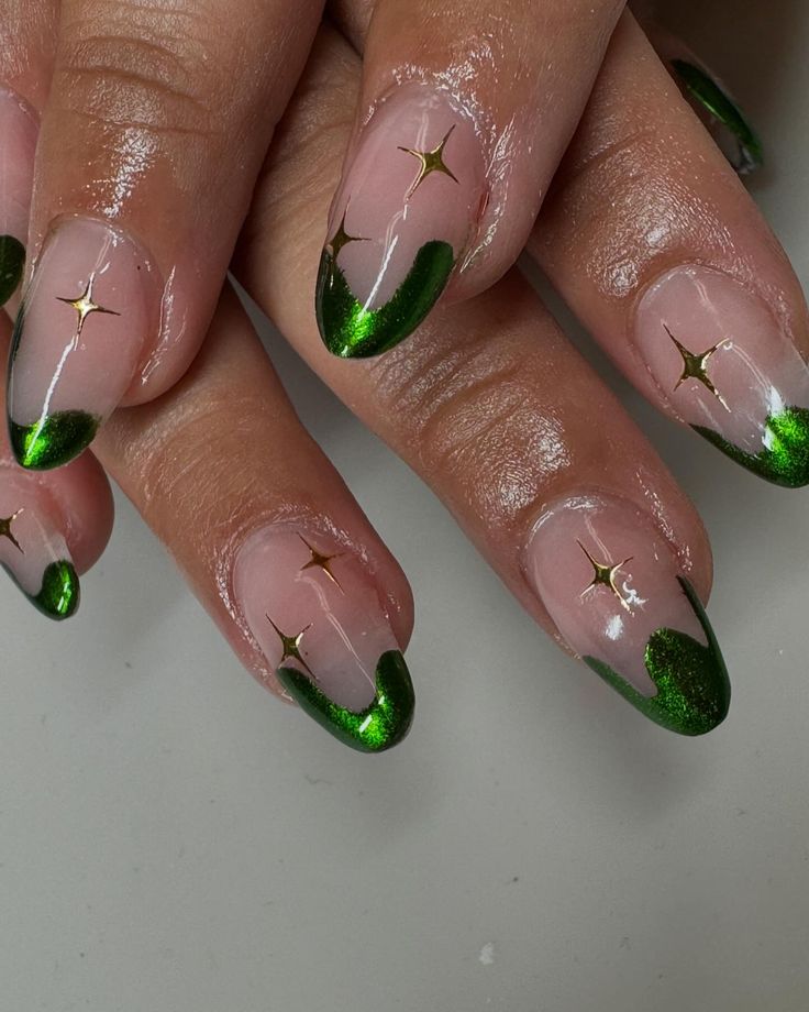 Chic Elegant Nail Design: Striking Green French Tips with Gold Star Accents on a Clear Base.