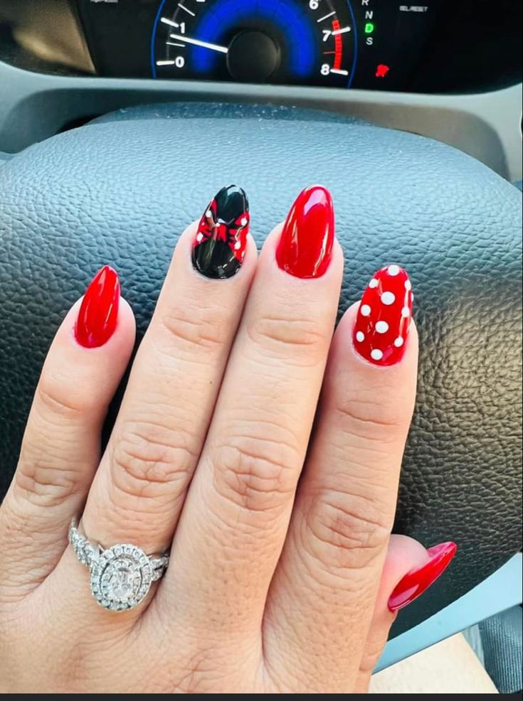 Playful and Vibrant Nail Design with Classic Red, Black Accents, and Whimsical Polka Dots.