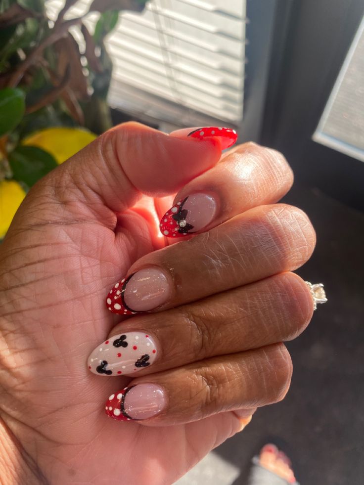 Charming Polka Dot Nail Design with Bold Colors and Heart Accents.