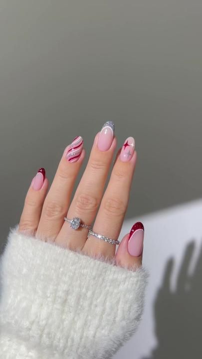 Playful Yet Elegant Multi-Colored Nail Design with Glitter and Stripes for Festive Occasions