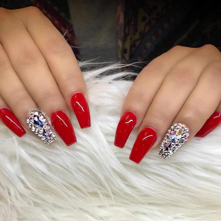 Glamorous Red Glossy Nail Design with Rhinestones for a Bold Statement.