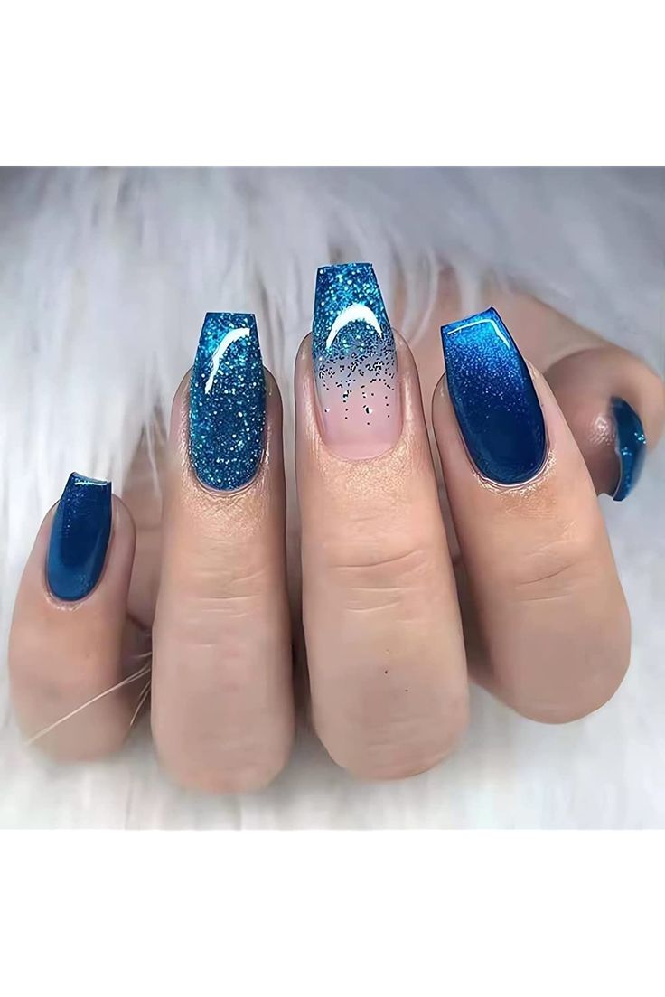 Vibrant Bold Blue Nail Design with Gradient and Glittery Accents