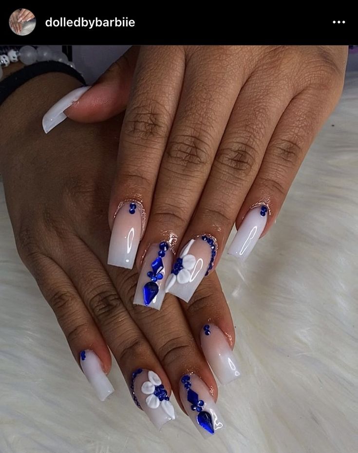 Chic Elegant Nail Design: Glossy White and Blue with Floral Patterns and Gem Accents