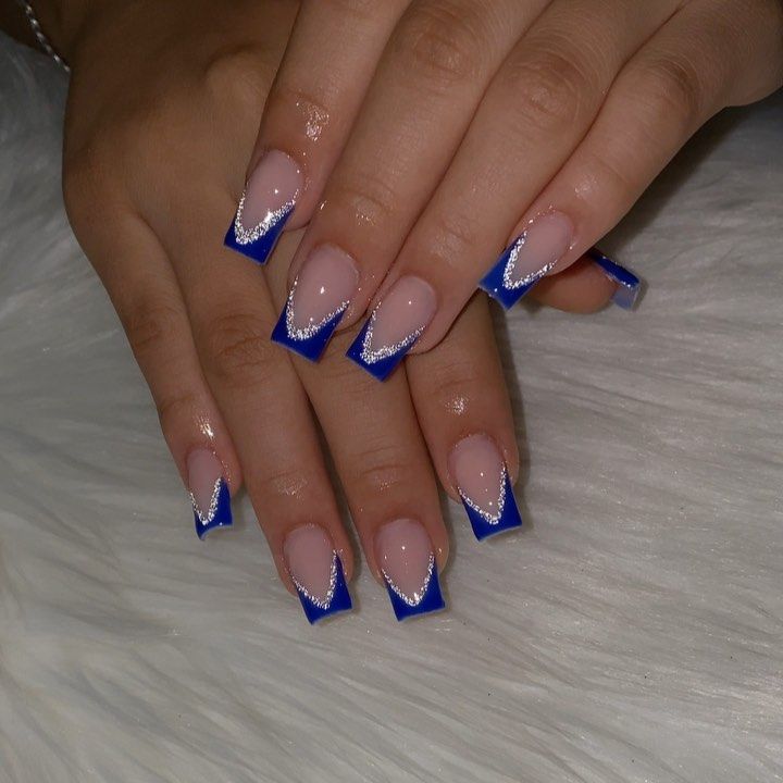 Chic Modern French Tip Nail Design with Glossy Blue Tips and Sparkling Silver Lines