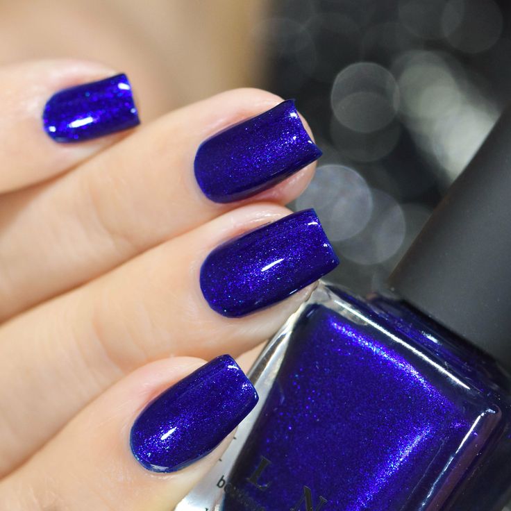 Glossy Cobalt Blue Nail Design with Dazzling Shimmer for a Bold Look.