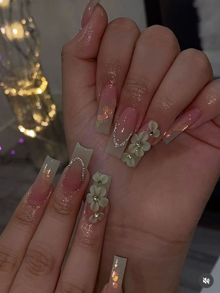 Sophisticated Floral Nail Art with Pink Ombre and Sparkling Accents