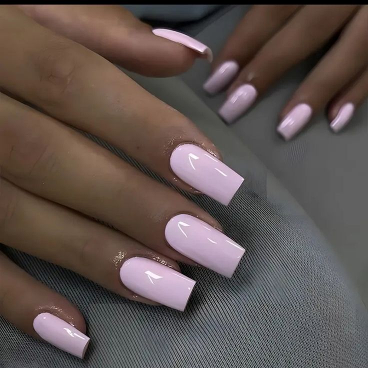 Chic Soft Pink Glossy Nail Design with Modern Square Tips for Versatile Elegance.