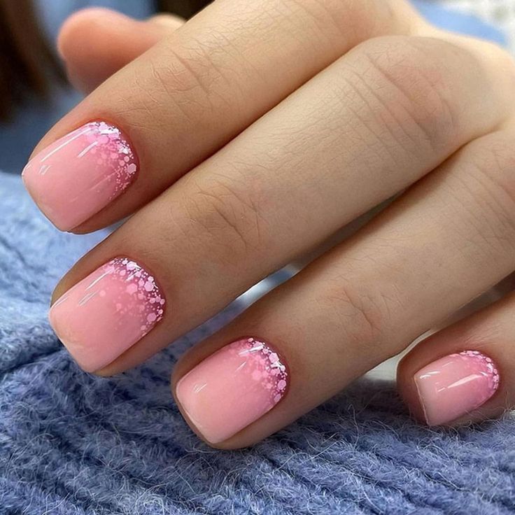 Chic Gradient Pink Nails with Glittery Tips for a Delicate Aesthetic.