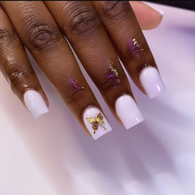 Elegant Light Pink Nail Design with Whimsical Gold Butterfly Accent.