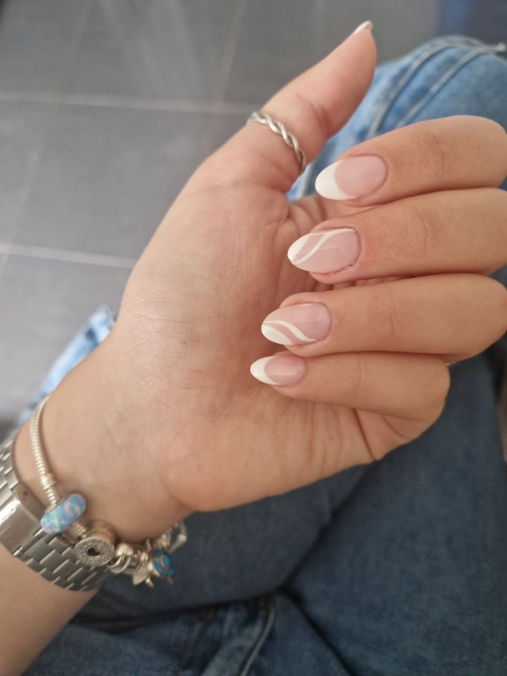 Chic Almond-Shaped Nail Design with Nude and White French Tips