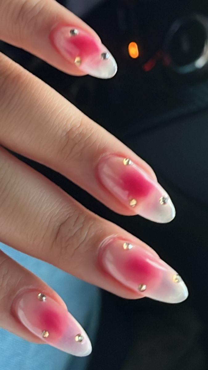 Elegant Almond-Shaped Gradient Nails with Gold Studs for a Chic Statement.