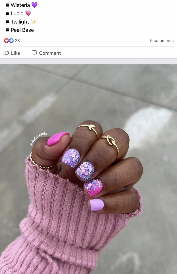 Playful Vibrant Nail Design with Pastel Pink and Glamorous Glitter Accents.