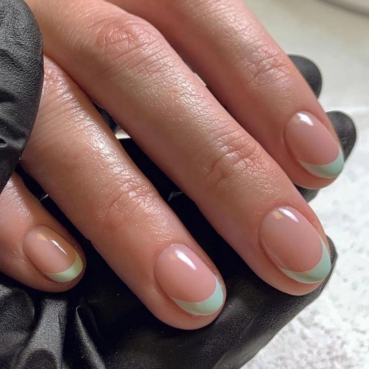 Soft Pink Base with Mint Green French Tips: A Modern and Elegant Nail Design.