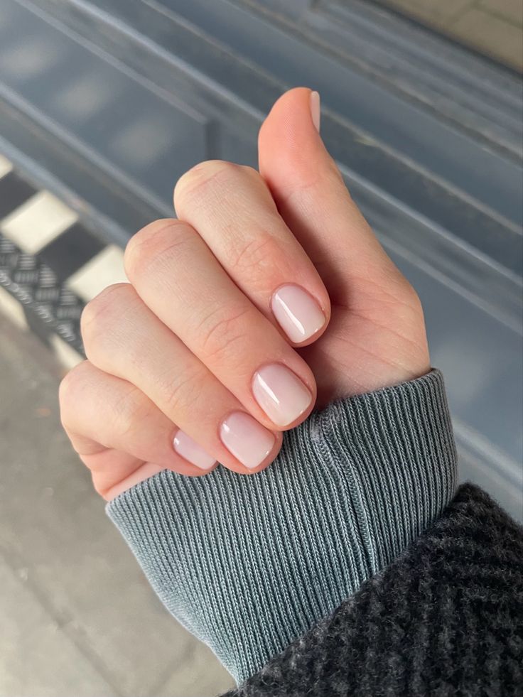 Elegant Minimalist Soft Pink Manicure: A Chic Touch for Winter Attire.