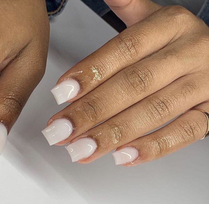 Elegant Chic Nude Glossy Nails with Square Tips and Gold Accents