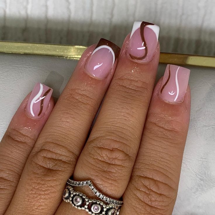 Chic Pink Nail Design with Glossy White and Rich Brown Accents