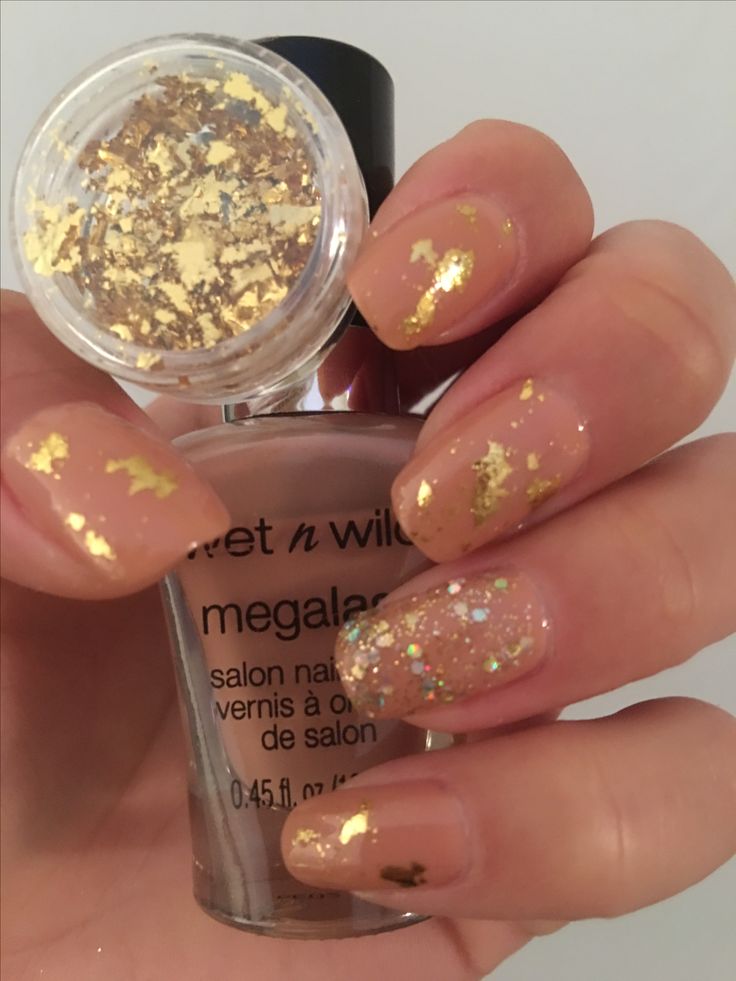 Elegant Nude Nail Design with Shimmering Gold Flakes for Any Occasion.