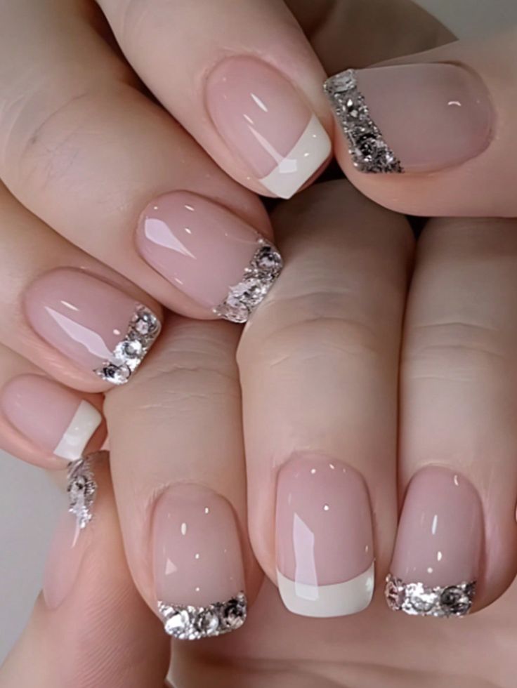 Refined Nude and White Nail Design Enhanced with Sparkling Silver Accents.