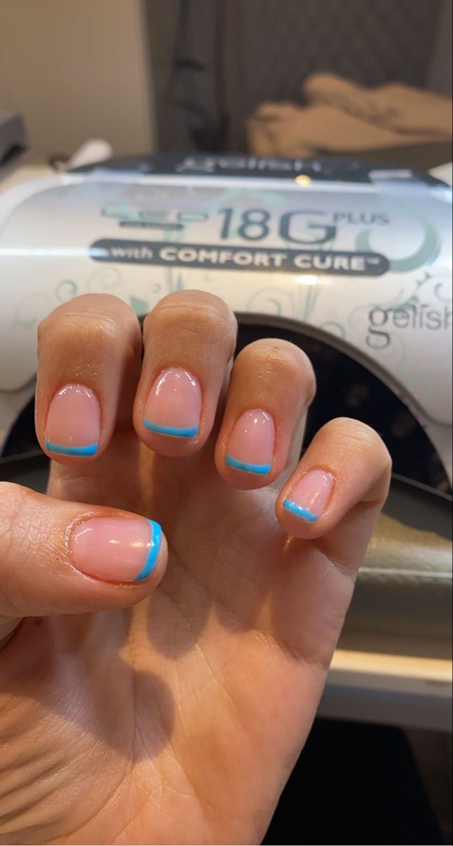 Chic Minimalist Nail Design: Soft Pink Base with Vibrant Blue Tips