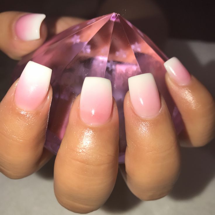 Chic Ombre Nail Design in Soft Pink and White with Glossy Finish and Sparkling Crystal Accent.