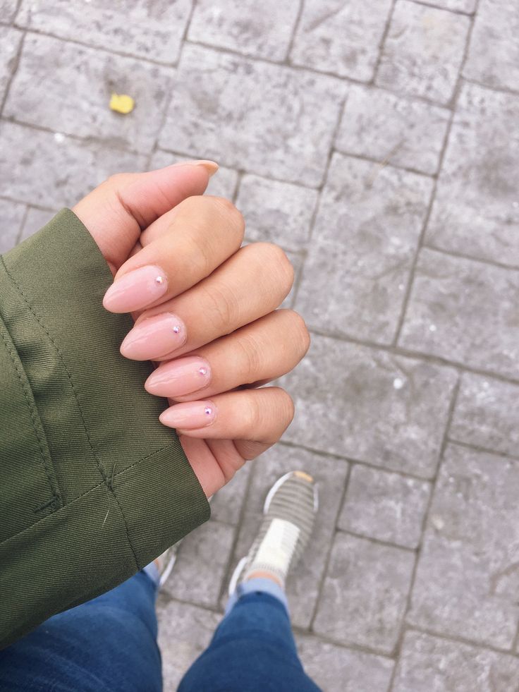 Elegant Soft Pink Almond-Shaped Nails with Rhinestones: A Sophisticated Minimalist Design for Any Occasion.