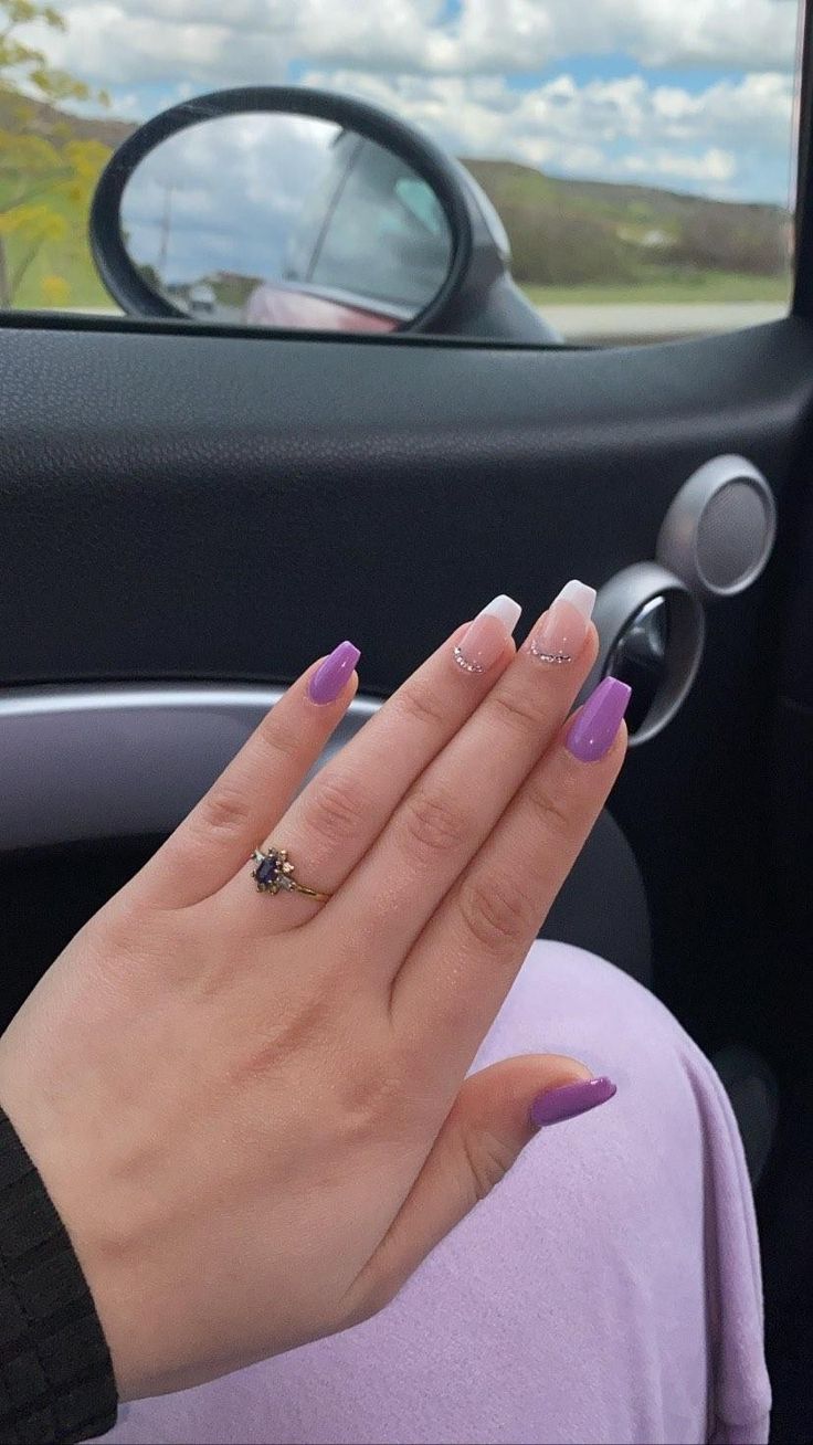 Elegant French Tips Meet Bold Purple in Stunning Nail Design