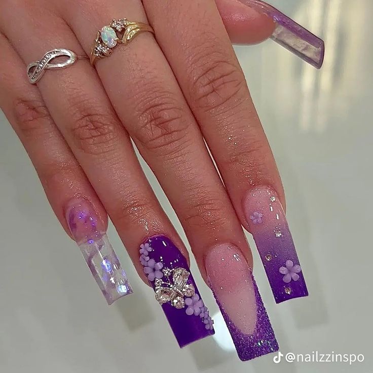 Chic Purple Gradient Coffin Nails with Floral and Glitter Accents