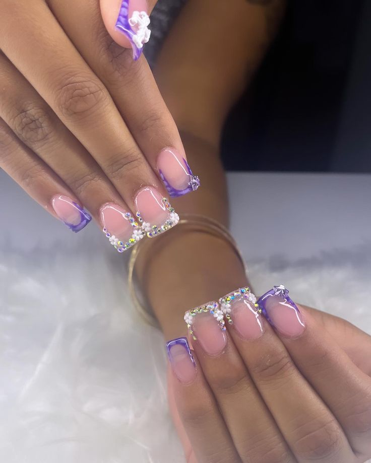 Chic Pink and Purple Square Nail Design with Rhinestones and Floral Accents.