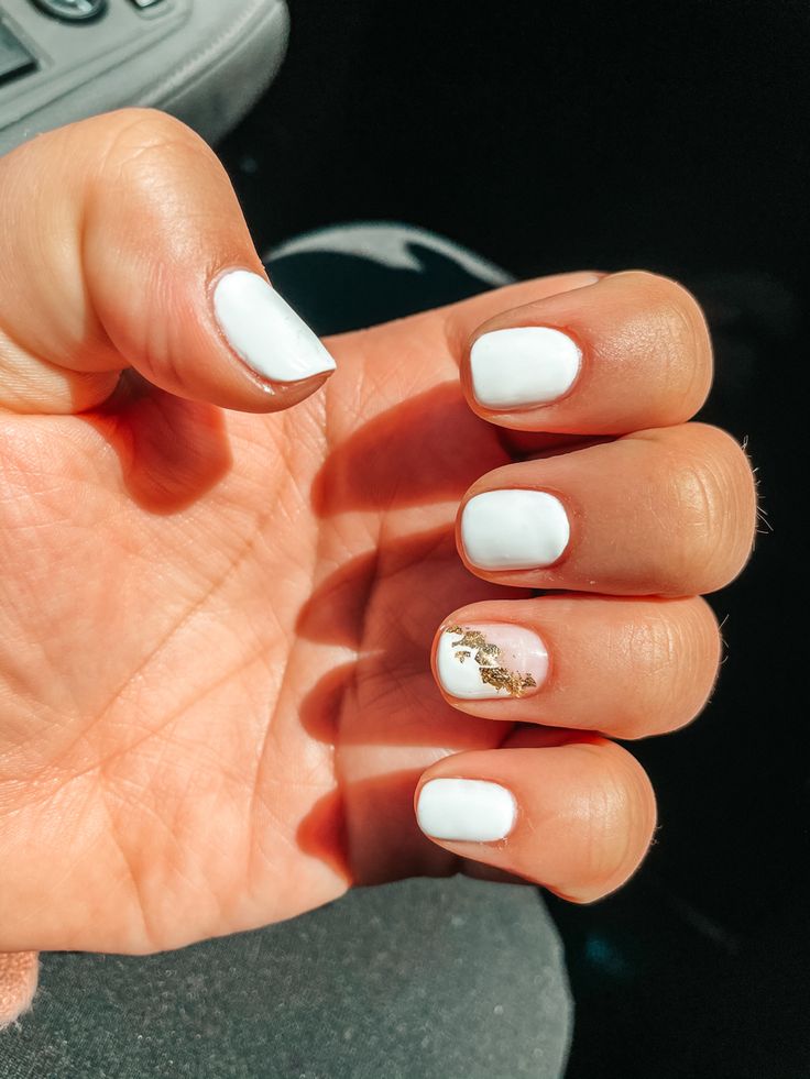 Chic Glossy White Nails with Gold Foil Accent for Versatile Elegance.