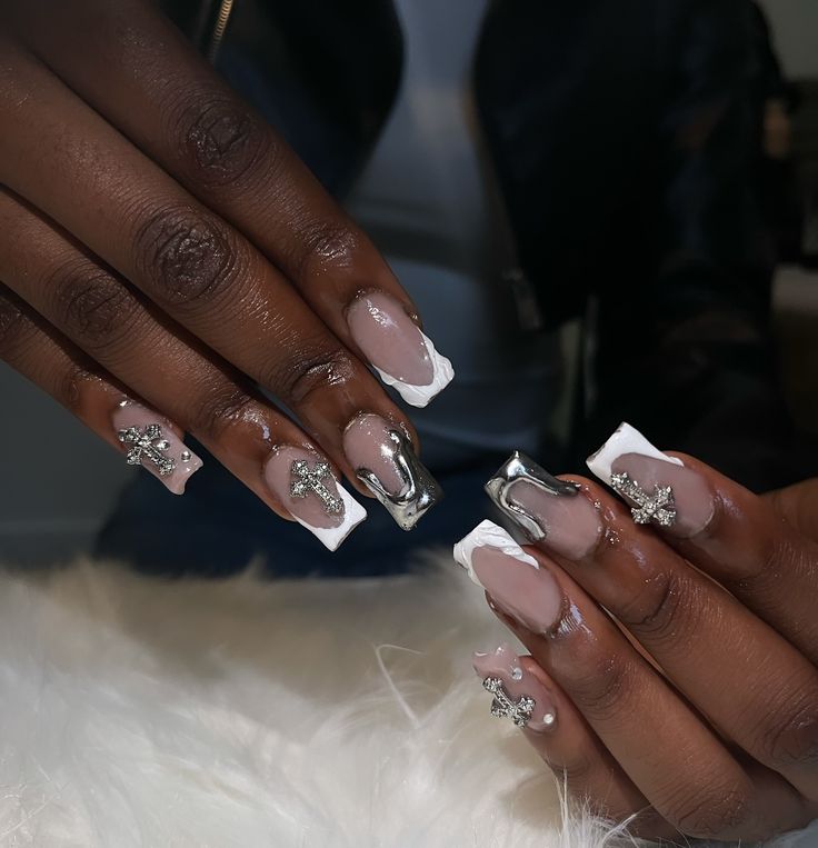 Chic Nail Design: Nude and White Polish with Glamorous Metallic Accents.