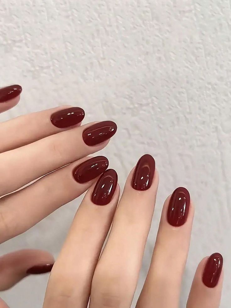 Timeless Sophistication: Elegant Oval Nails in Deep Red Polish