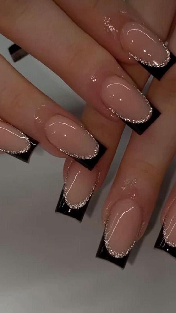 Sophisticated Nude and Glossy Black Nail Design with Glitter Accents