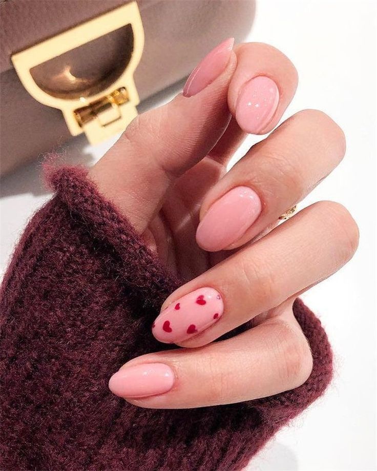 Trendy Chic Nail Design: Soft Pink with Playful Red Heart Accent