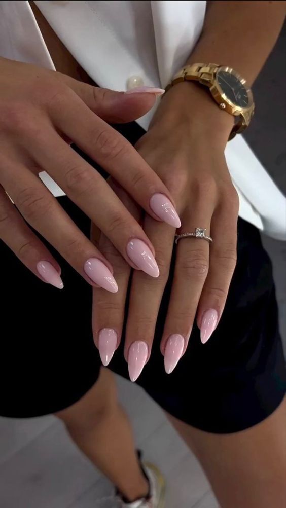 Chic and Sophisticated Long Pink Nails with Elegant Accessories.