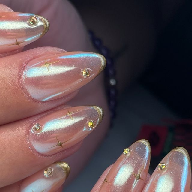 Chic Ombre Nail Design with Pearlescent Tips and Glamorous Accents