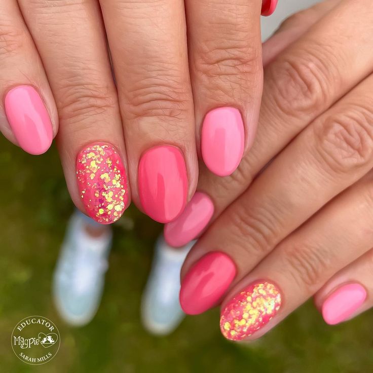 Bold & Cheerful Vibrant Pink Nail Design with Glossy and Glitter Accents.