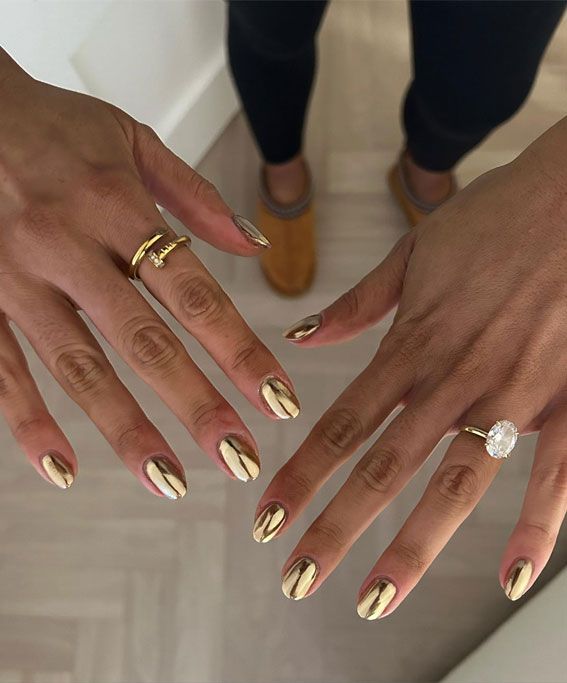 Elegant Gleaming Gold Almond Nails for a Glamorous Look.