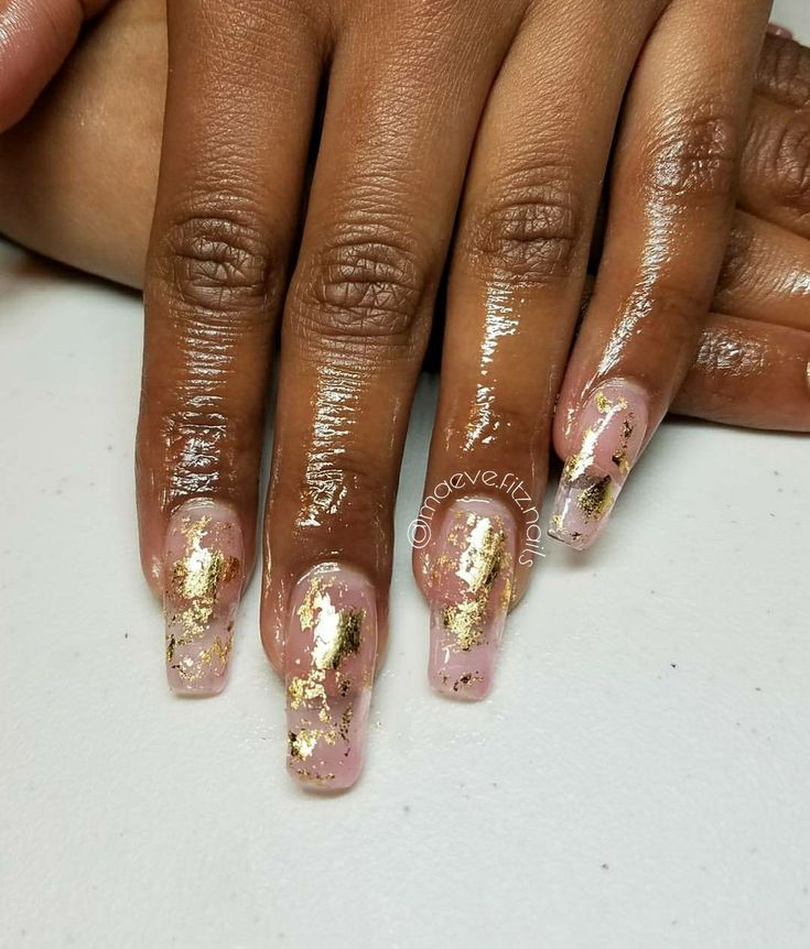 Sophisticated Soft Pink Nails Enhanced with Shimmering Gold Foil Accents.