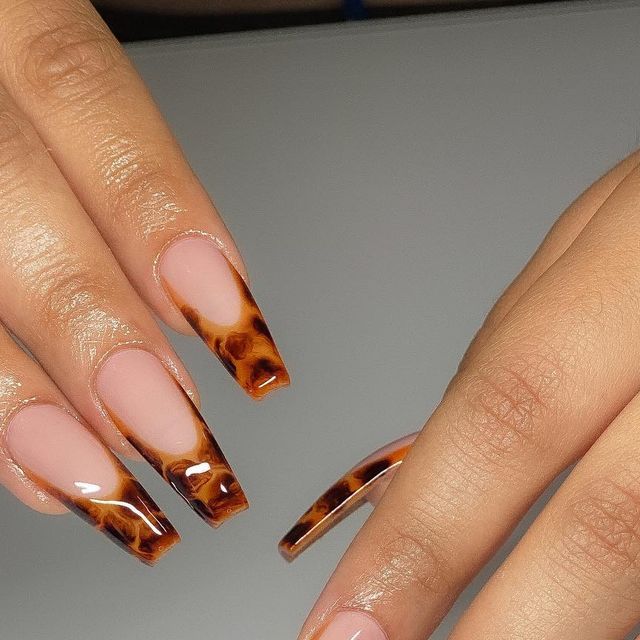 Sophisticated Tortoiseshell-Inspired Nails with Glossy French Tip Design