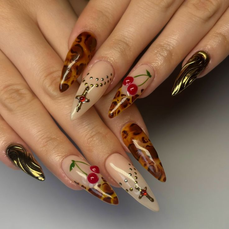 Chic Nail Art: Glossy Tortoiseshell Patterns with Cherry Motifs and Gold Accents.