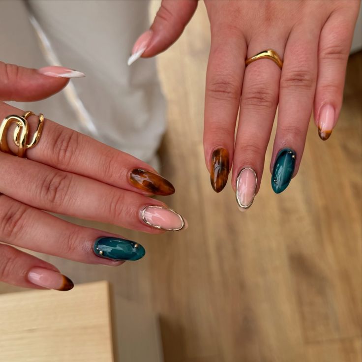 Marbled Almond Nail Design with Earthy Tones and Vibrant Accents