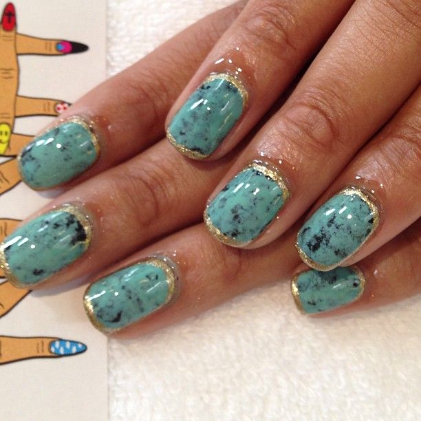 Elegant Turquoise Nail Design with Textured Finish and Golden Accents for a Bold, Chic Statement.