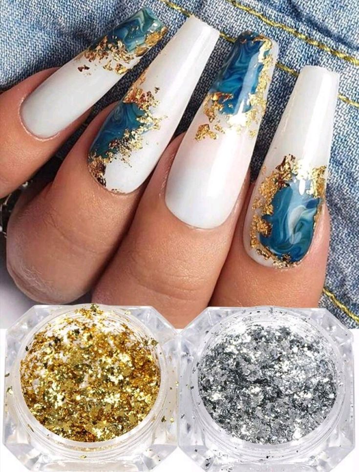 Chic Elegant Nail Design: Long Tapered Tips with Blue Swirls, Metallic Gold Accents, and Glitter Glamour.