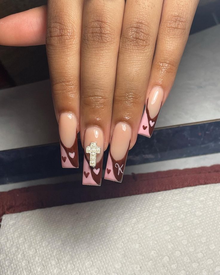 Chic Nude and Chocolate Nail Design with Heart and Sparkling Cross Accents