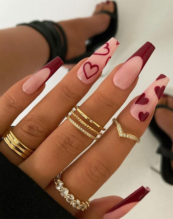 Chic Nail Design: Elegant Burgundy and Nude with Playful Heart Motifs