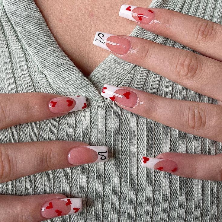 Elegant Long French-Tip Nails with Playful Red Heart Designs